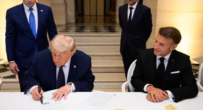 Trump signs a Memorandum of Understanding between the Islamic Republic of Iran and the United States at the Palace of Versailles on 17 June 2026