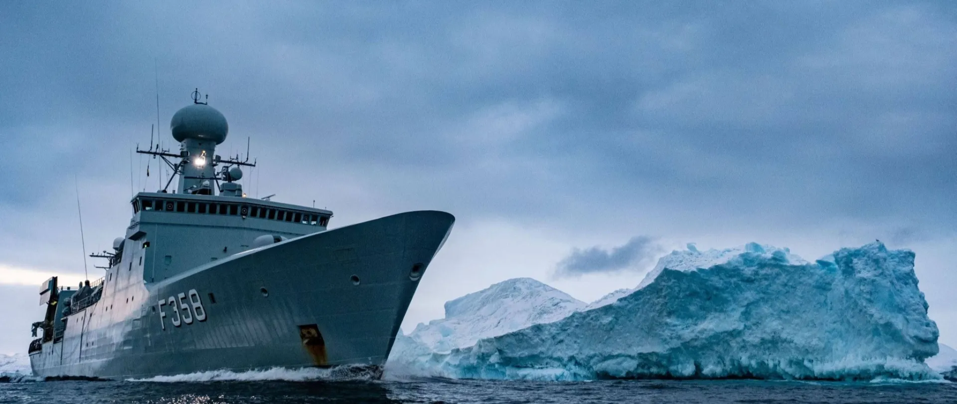 Royal Danish Navy frigate HDMS Triton passes an iceberg in the waters around Greenland, 6 November 2022